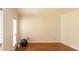 Empty living room with hardwood floors, window with blinds and baseboard trim at 5150 Rockford Ln, Stockbridge, GA 30281