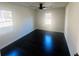 Bright bedroom featuring a ceiling fan and hardwood flooring at 53 Springside Se Dr, Atlanta, GA 30354