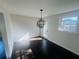 Bright dining room with dark hardwood floors and a stylish chandelier at 53 Springside Se Dr, Atlanta, GA 30354