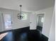 Bright dining room with dark hardwood floors and a stylish chandelier at 53 Springside Se Dr, Atlanta, GA 30354