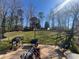 Spacious backyard featuring a grill, basketball hoop, lush lawn, and mature trees at 5744 Amalfi Way, Douglasville, GA 30135