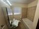 Bathroom with tile shower, modern vanity, and window at 5744 Amalfi Way, Douglasville, GA 30135