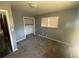 This bedroom features neutral walls, carpet, natural light, and a closet for storage at 5744 Amalfi Way, Douglasville, GA 30135