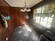 Bright dining area with natural light, wood paneling and tile floors at 5744 Amalfi Way, Douglasville, GA 30135