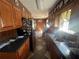 Galley kitchen featuring wood cabinets, stainless steel appliances, and tile floor at 5744 Amalfi Way, Douglasville, GA 30135