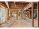 Unfinished basement is framed, awaiting customization, with rough-in plumbing and electrical at 816 Ivy Ridge Dr, Loganville, GA 30052