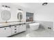 Elegant bathroom features a freestanding tub, double vanity, and marble floors at 816 Ivy Ridge Dr, Loganville, GA 30052