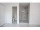 Bathroom with marble shower and flooring at 816 Ivy Ridge Dr, Loganville, GA 30052