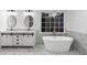 Elegant bathroom features a freestanding tub, double vanity, and marble floors at 816 Ivy Ridge Dr, Loganville, GA 30052