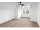 Bright bedroom features new floors, a modern ceiling fan, and large windows at 816 Ivy Ridge Dr, Loganville, GA 30052