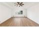 Spacious bedroom with tray ceiling, ceiling fan, and large window at 816 Ivy Ridge Dr, Loganville, GA 30052