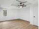 Bedroom features new flooring, fresh white paint, ceiling fan, and large windows at 816 Ivy Ridge Dr, Loganville, GA 30052