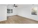 This bedroom offers new floors, neutral paint, a ceiling fan and double windows at 816 Ivy Ridge Dr, Loganville, GA 30052