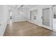 Well-lit dining area with hardwood floors, white walls, and elegant chandelier, seamlessly connected to living areas at 816 Ivy Ridge Dr, Loganville, GA 30052