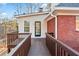 Exterior showing deck access and brick accents, offering a blend of natural beauty at 816 Ivy Ridge Dr, Loganville, GA 30052