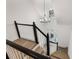 Bright foyer features a modern chandelier and staircase at 816 Ivy Ridge Dr, Loganville, GA 30052
