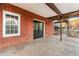 Spacious brick patio features dual doors to the home and a cozy atmosphere at 816 Ivy Ridge Dr, Loganville, GA 30052