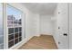 Walk-in closet features wood flooring, adjustable shelves and a window at 816 Ivy Ridge Dr, Loganville, GA 30052