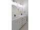 Bathroom featuring double vanity with modern fixtures and sleek gold accents at 2143 Lyle Ave, College Park, GA 30337