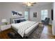Serene bedroom featuring neutral walls, a soft rug, and furniture with simple design at 2143 Lyle Ave, College Park, GA 30337