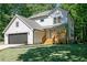 Charming two-story home with a front porch and a well-manicured lawn at 2143 Lyle Ave, College Park, GA 30337