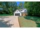 Charming two-story home with a front porch and a well-manicured lawn at 2143 Lyle Ave, College Park, GA 30337