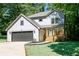 Charming two-story home with a front porch and a well-manicured lawn at 2143 Lyle Ave, College Park, GA 30337