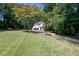 Two-story home with a large, lush lawn and mature trees at 2143 Lyle Ave, College Park, GA 30337