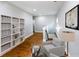 Upstairs hallway with built-in bookshelves and a cozy seating area at 2143 Lyle Ave, College Park, GA 30337