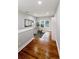 Bright hallway with hardwood floors and comfortable seating area at 2143 Lyle Ave, College Park, GA 30337