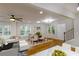 Bright living space featuring a modern dining area, hardwood floors, and natural light at 2143 Lyle Ave, College Park, GA 30337
