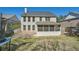 Backyard featuring a screened porch, patio, and lush lawn at 379 Peachstone Way, Lawrenceville, GA 30043