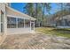 Backyard patio with screened porch and a trampoline at 379 Peachstone Way, Lawrenceville, GA 30043
