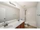 Bathroom featuring a double vanity, a large mirror, and a shower-tub combo at 379 Peachstone Way, Lawrenceville, GA 30043