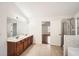 Bright bathroom featuring double vanity, walk-in shower, and tile flooring at 379 Peachstone Way, Lawrenceville, GA 30043
