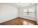 Bedroom featuring hardwood floors and a window for natural light at 379 Peachstone Way, Lawrenceville, GA 30043