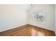 Bedroom featuring hardwood floors and a window for natural light at 379 Peachstone Way, Lawrenceville, GA 30043