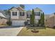 Charming two-story home with manicured lawn, brick accents, and two car garage at 379 Peachstone Way, Lawrenceville, GA 30043