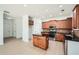 Modern kitchen with wooden cabinets, stainless steel appliances, and a center island at 379 Peachstone Way, Lawrenceville, GA 30043