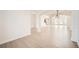 Spacious living area with hardwood floors, archways, and staircase access at 379 Peachstone Way, Lawrenceville, GA 30043