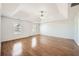 Bright main bedroom with hardwood floors, a tray ceiling, and ample space for relaxation at 379 Peachstone Way, Lawrenceville, GA 30043