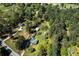 Aerial view of a property featuring homes, lush greenery, and a swimming pool at 4739 Cook Sw Rd, Stockbridge, GA 30281