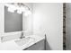Bright bathroom features a marble vanity top, modern faucet, and contemporary lighting at 4739 Cook Sw Rd, Stockbridge, GA 30281