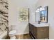 Stylish bathroom with modern vanity, marble countertops, and elegant tile accents at 4739 Cook Sw Rd, Stockbridge, GA 30281