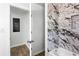 Bathroom with a marble-tiled shower/bathtub and a closet at 4739 Cook Sw Rd, Stockbridge, GA 30281