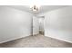 Bedroom with neutral carpet, white walls, modern ceiling light, and an open doorway to another room at 4739 Cook Sw Rd, Stockbridge, GA 30281