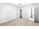 Bedroom featuring plush carpeting, neutral paint, a modern light fixture, and an attached bathroom at 4739 Cook Sw Rd, Stockbridge, GA 30281