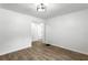 Dining room with wood-look floors, white walls, and modern lighting creating a cozy and inviting space at 4739 Cook Sw Rd, Stockbridge, GA 30281