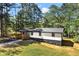Exterior of a home with a well-manicured lawn and newly constructed deck at 4739 Cook Sw Rd, Stockbridge, GA 30281