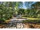 Charming home nestled among mature trees, featuring a circular driveway and well-maintained lawn at 4739 Cook Sw Rd, Stockbridge, GA 30281